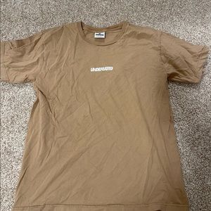 Tan undefeated shirt